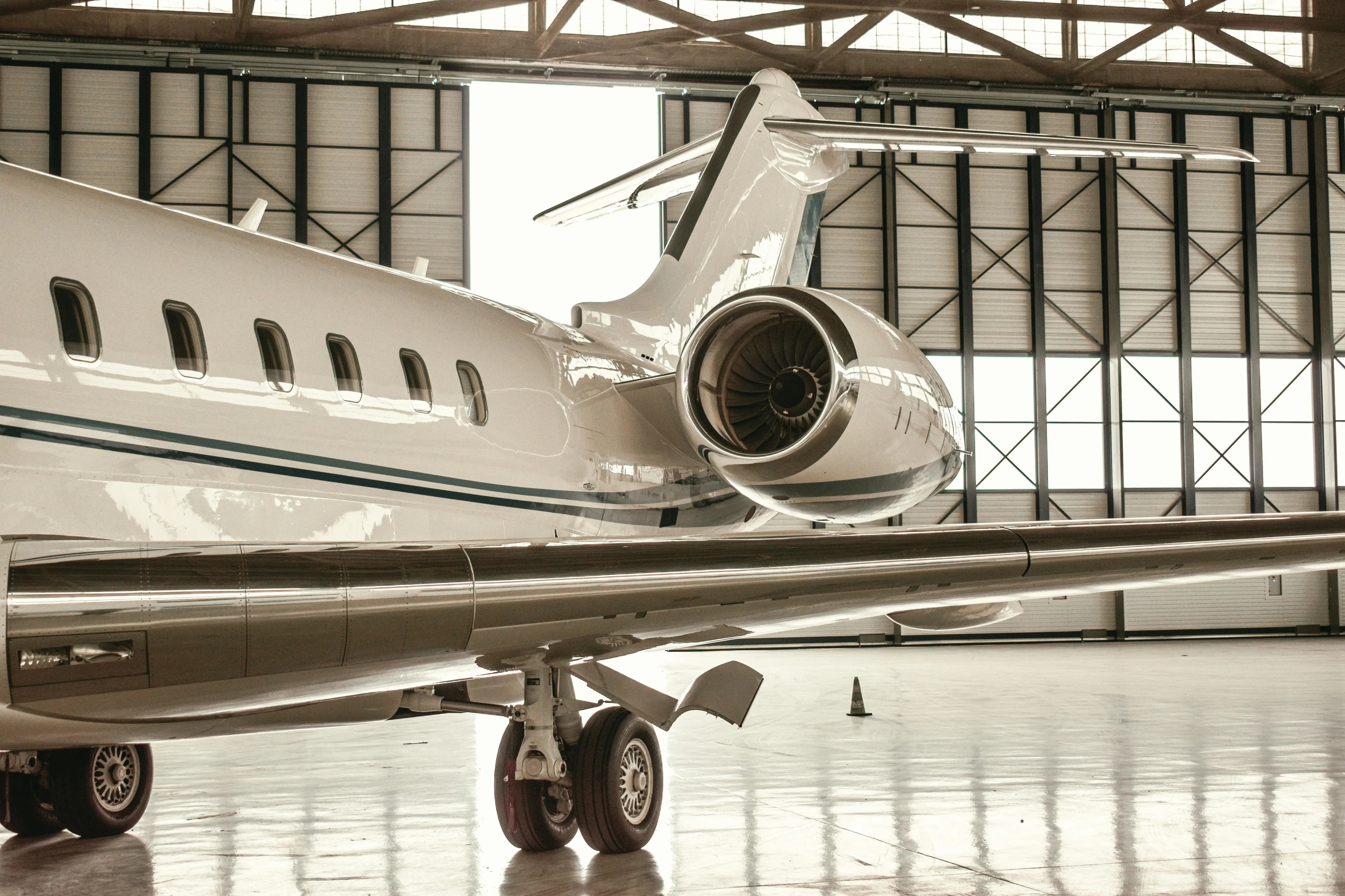 Aircraft undergoing maintenance review in a hangar
